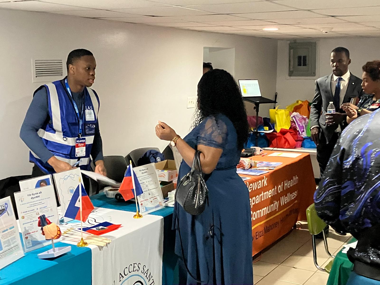 LAS volunteer speaking with a community member